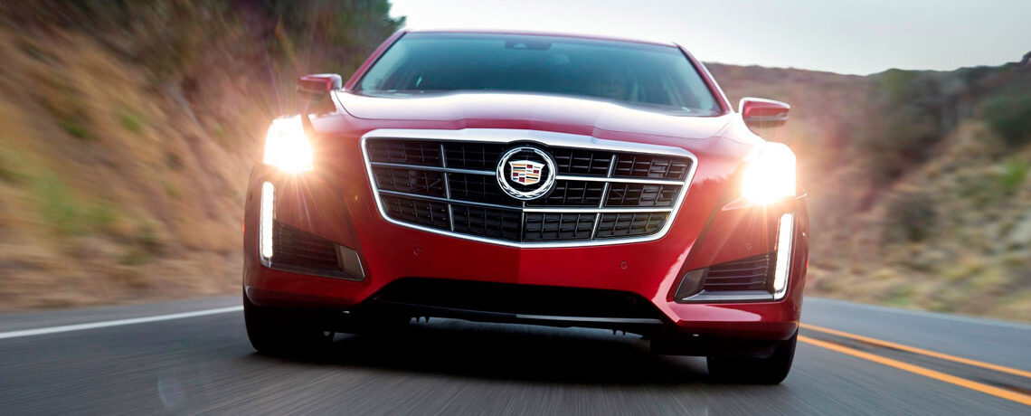 2014 red Cadillac CTS driving