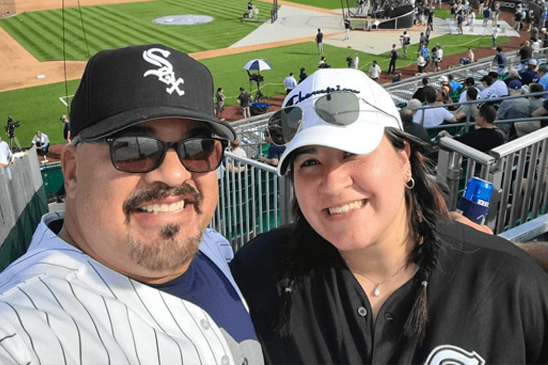 man and woman at baseball game